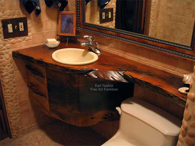 live edge bathroom vanity showing one end of solid mesquite slab